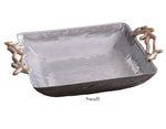 Beatriz Ball’s Ocean Coral Square Bowl Collection features a small rectangular silver serving tray with a textured surface and gold-tone coral-shaped handles.