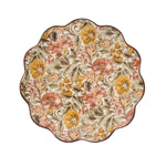 The Willa Dinnerware Collection by Juliska features a round scalloped charger with dense romantic florals in yellow, pink, and green plus a brown rim—perfect as a charming serving platter.