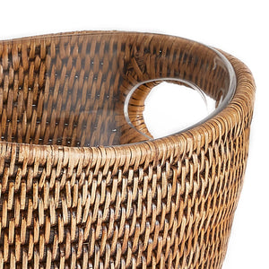 Close-up of the Napa Home & Garden Burma Rattan Beverage Tub, showcasing its transparent curved handle. This durable, water-tight basket is ideal for stylish indoor use, displayed against a crisp white background.