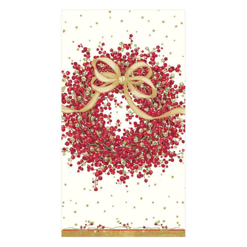 The Caspari Pepperberry Napkin Collection features triple-ply napkins printed in Germany with a red berry, green leaf, and gold ribbon wreath on a white background accented by elegant gold dots.
