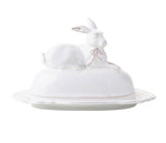 Part of Juliska’s Whitewash Bunny Serveware Collection, this elegant white butter dish features a rabbit-shaped lid resting on an oval ceramic base.