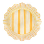 The Cabana Stripe Melamine Dinnerware Collection by Juliska features round plates with scalloped edges, ruffle trim, alternating yellow and white stripes, a radial rim pattern, and durable shatterproof melamine construction.