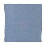 The Berry Trim Napkin Collection by Juliska features a square blue woven cotton napkin with subtle texture and a simple stitched border, shown on a white background.