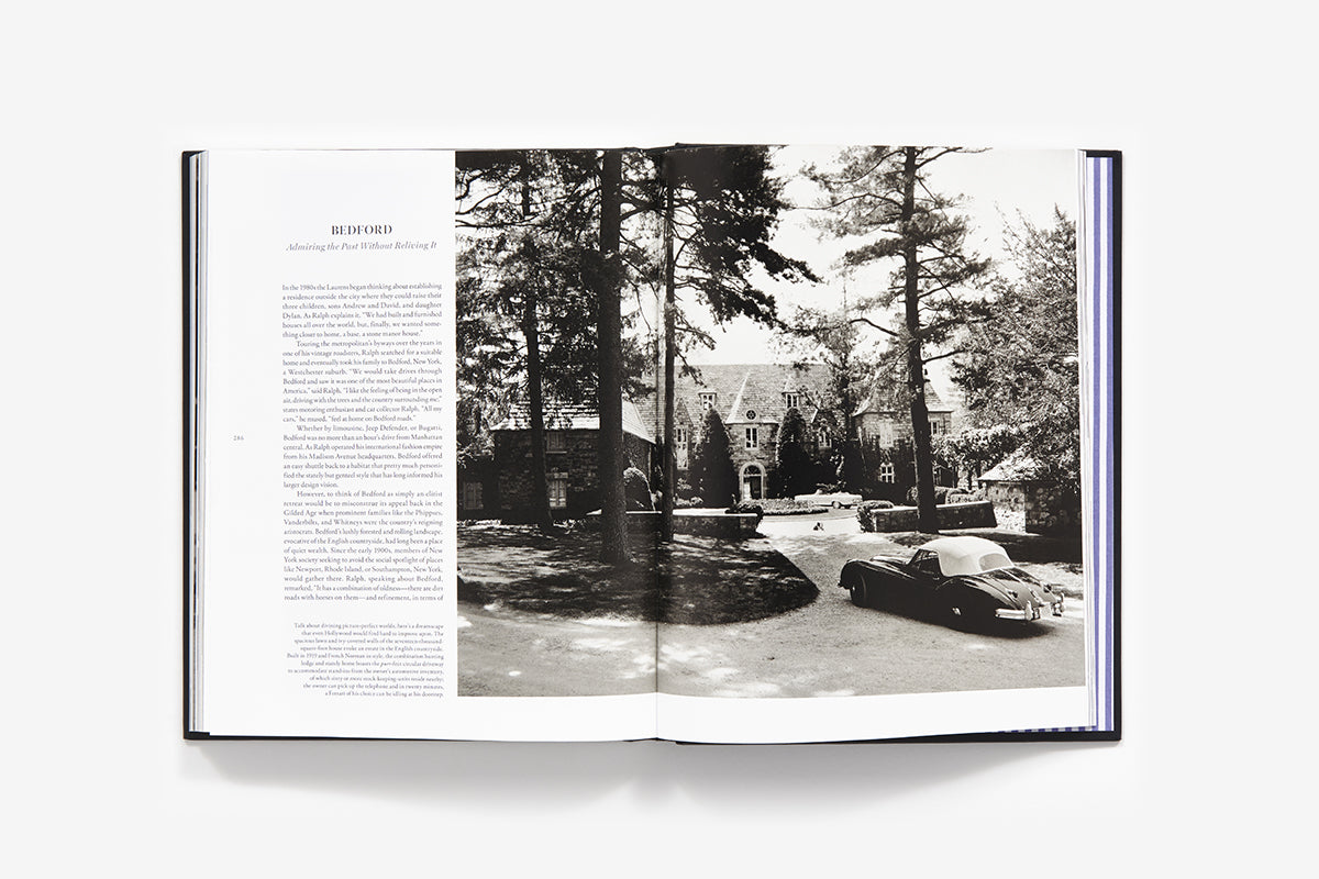An open book, "Ralph Lauren: In His Own Fashion" by Abrams, shows a text page on the left and a black-and-white photo of a large house, circular driveway, and vintage convertible—ideal for any stylish coffee table.
