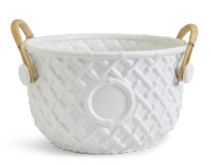 The Hampton Faux Bamboo Fretwork Party Bucket by Two's Company features white ceramic with a textured lattice pattern, circular front detail, and two tan bamboo handles for a Chinoiserie-inspired look.