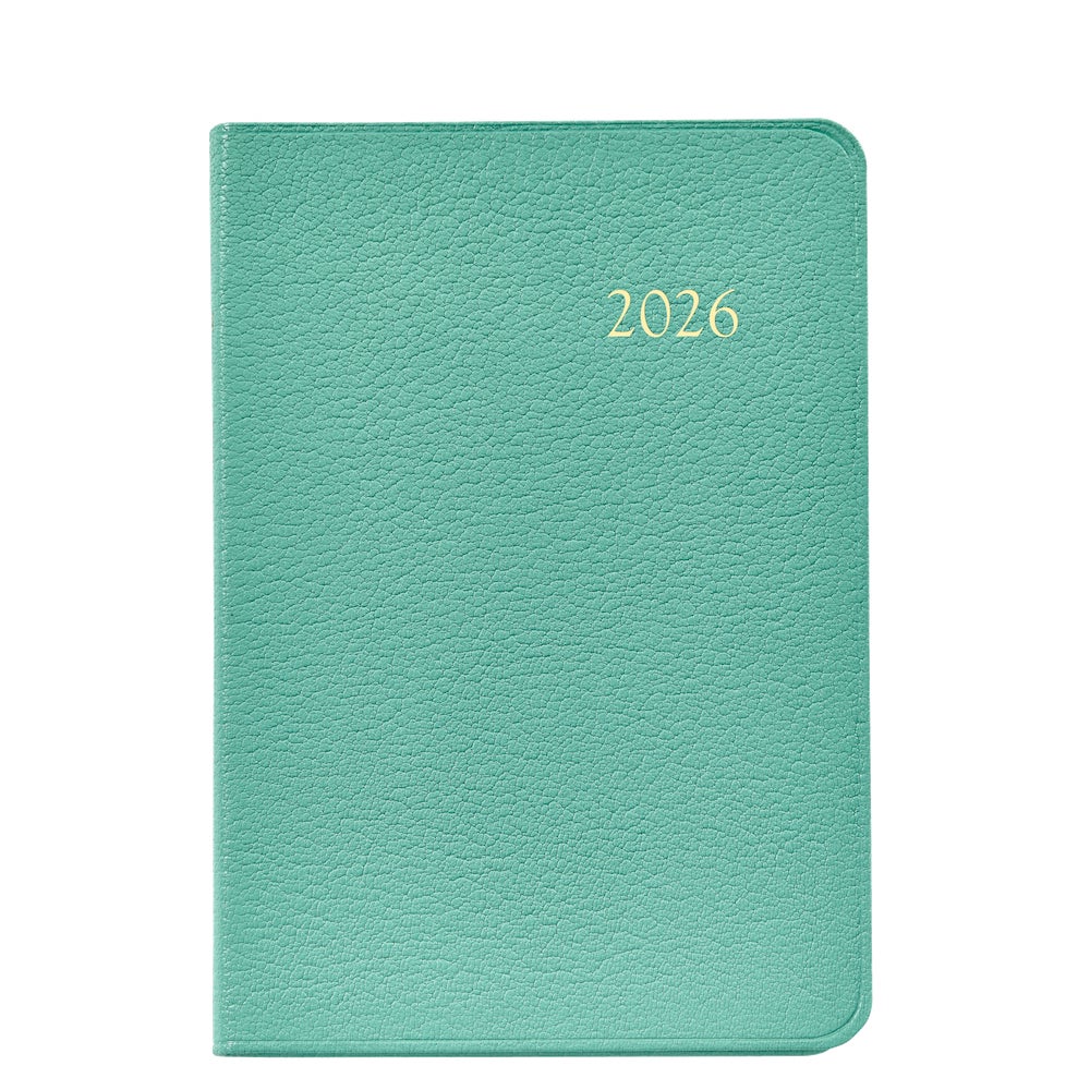 The Graphic Image 2026 Daily Journal Planner Collection features a green textured day-at-a-view planner with "2026" embossed in gold on the cover.