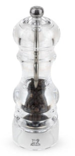 The Peugeot Saveurs Nancy Acrylic Mill from the Salt and Pepper Mill Collection is an 18 cm clear mill filled with black peppercorns, featuring a metal grinding mechanism and round knob—a stylish addition to any table.