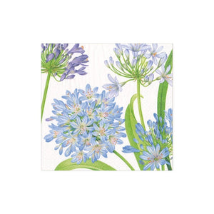 The Caspari Agapanthus Garden Collection features eco-friendly, triple-ply napkins adorned with light blue and purple agapanthus flowers and green foliage on a white background.