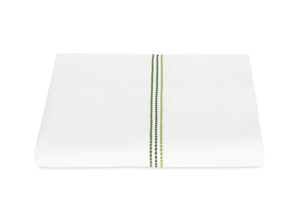 The Amara Triple Pearl Bedding Collection by Matouk in Palm Green features a folded white sheet with two parallel green stitched lines and a subtle pearl motif for an elegant touch.