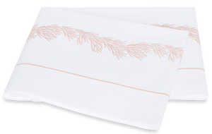 White Matouk Atoll Bedding Collection bed sheet with pink Ceylon cotton percale embroidery designs.