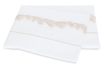 Two folded white pillowcases from the Matouk Atoll Bedding Collection, Dune, crafted from 520-thread count Ceylon cotton percale, feature an elegant beige embroidered edge pattern and are displayed on a plain background.
