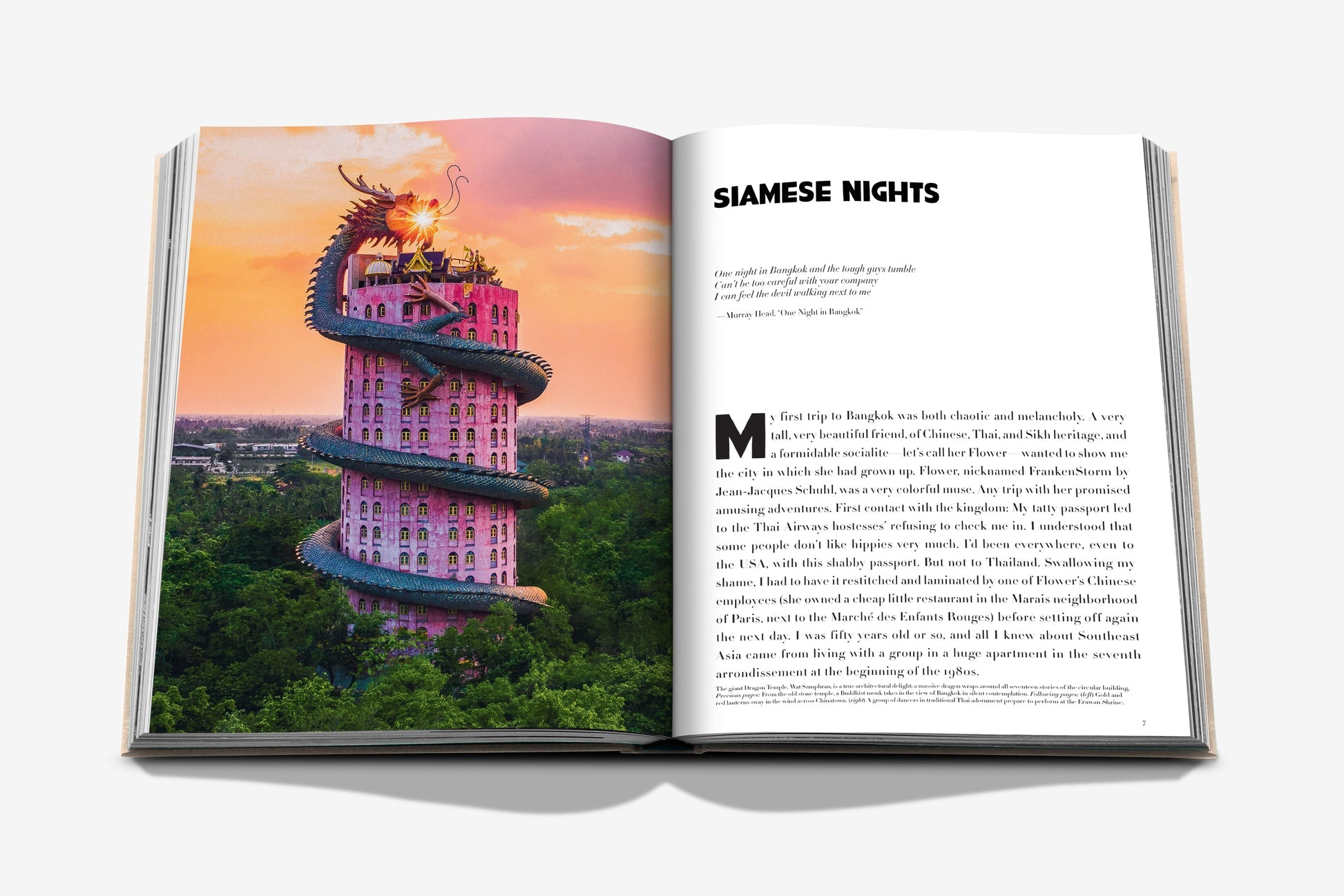 An open book reveals a building wrapped by a dragon sculpture on one page and text titled "Bangkok Spirit" on the other, echoing the vibrant allure of Bangkok's street food and the serenity of its Buddhist temples. (Assouline).