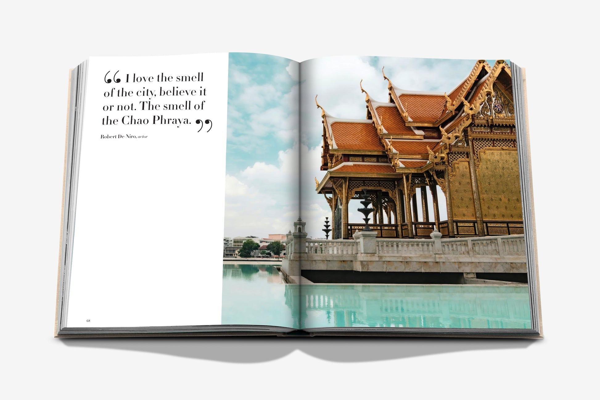 The Assouline "Bangkok Spirit" book features a quote on the left page and a photo of a traditional Thai pavilion by a pool on the right, encapsulating Bangkok's charm.