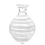 The Bella Bianca Carafe Collection by William Yeoward Crystal features a clear glass carafe with horizontal white stripes, a round body, and a narrow neck. 35 oz capacity. Ideal for serving wine. Proposition 65 warning applies for California residents.