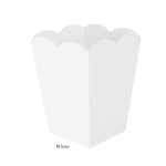 A plain white, scalloped-edge paper popcorn box is shown against a white background, its design reminiscent of the Addison Ross Scalloped Lacquer Waste Bin Collection. The word "White" is labeled below.
