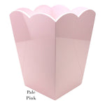 A pale pink waste bin from the Addison Ross Scalloped Lacquer Collection, featuring a scalloped-edge container and an elegant faceted design.