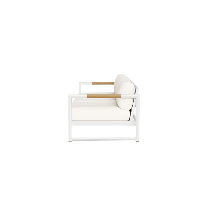 A modern white armchair with beige cushions and wooden armrests, shown from the side on a white background, pairs perfectly with modern outdoor furniture like HARBOUR OUTDOOR’s Breeze XL Sofa in White Panama Blanco or an aluminum teak sofa.