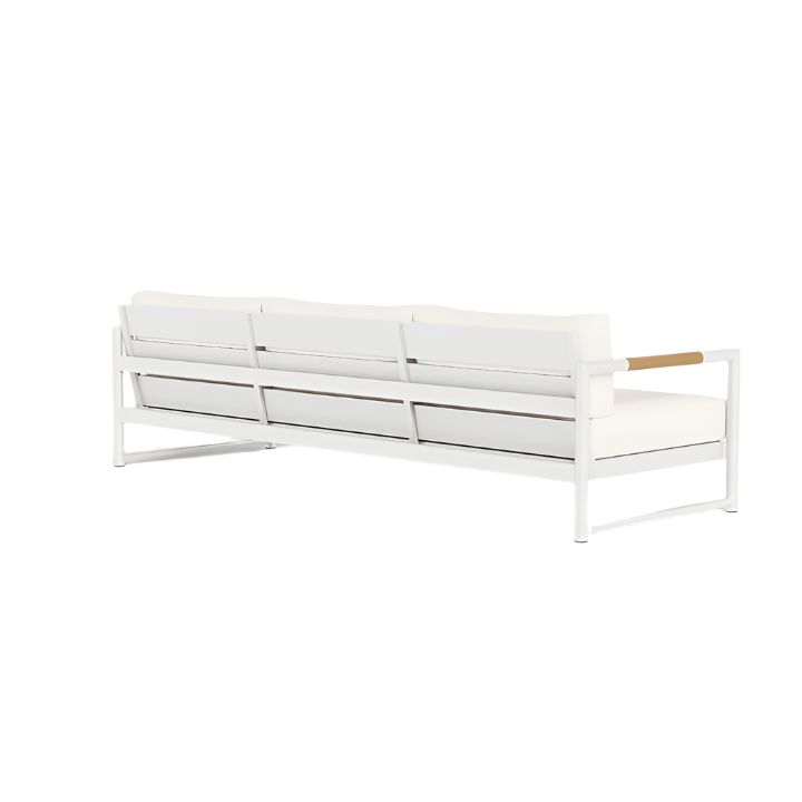 The HARBOUR OUTDOOR Breeze XL Sofa in White Panama Blanco features a modern aluminum frame, plush white cushions, and teak armrest accents—an elegant three-seater outdoor piece viewed from the back.