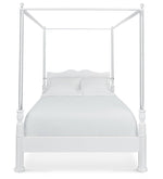 The Garbo Bed by Bunny Williams is a white four-poster canopy bed with a painted wood frame, headboard, white bedding, and two pillows, shown from the front against a plain background.