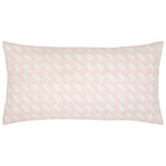 The Vikas Lotus Bolster by John Robshaw features a light pink geometric pattern on white, inspired by vintage tilework.