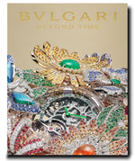 A luxurious Assouline watch adorned with colorful gemstones and intricate floral designs is displayed with the tagline "Beyond Time," exemplifying Swiss-Italian watchmaking excellence.