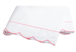 The Butterfield Bedding Collection, Azalea by Matouk features a folded white Egyptian cotton percale bedsheet with scalloped edges and a single pink line of trim.