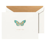 The Butterfly Engraved Thank You Card Set by Crane features a white card with a gold and blue butterfly and "THANK YOU" text, paired with an open, gold-lined envelope—ideal for sharing a heartfelt handwritten note.