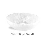 A small, round, white marbled bowl from the White Resin Serveware Collection by Nashi Home sits above the text "Wave Bowl Small" on a plain background.