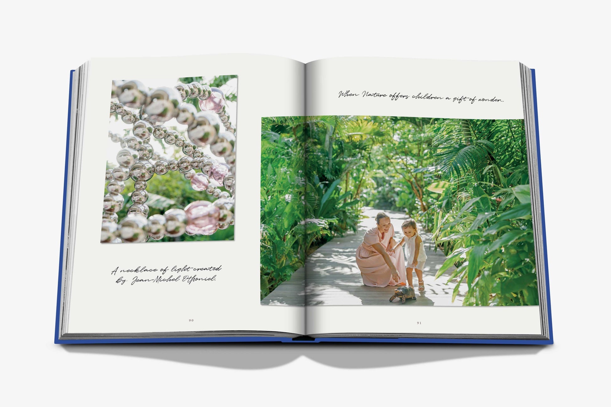 An open book features a woman and child with a toy dinosaur in a lush garden, embodying Cheval Blanc's bespoke service. The adjacent page shows shells with handwritten notes beneath, capturing Assouline's luxury hospitality essence in every detail.