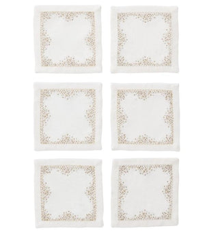 The Kim Seybert Pin Dot Cocktail Napkin Set features six white linen napkins with beige embroidered borders, arranged in two rows of three on a white background—perfect for adding elegance to your table setting.