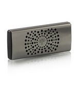 The Baobab Collection Car Diffuser by Baobab is a rectangular metallic device with rounded corners, circular front holes, and a tree logo at the center, designed to diffuse fragrance via your car's ventilation system.