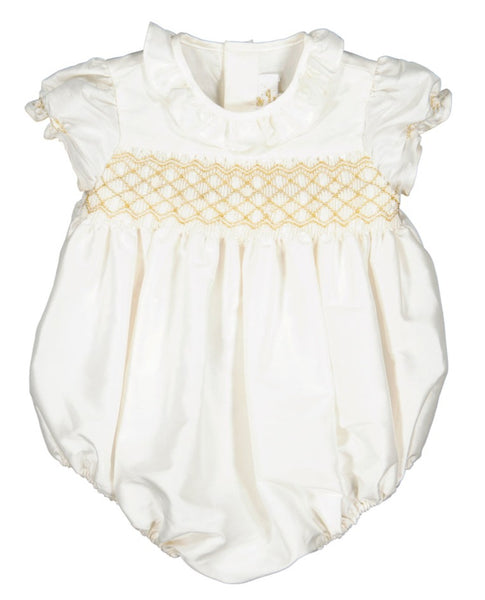 White Antoinette baby dress with short sleeves and decorative golden embroidery on the chest, isolated on a white background.