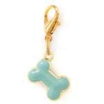 The Foggy Dog Blue Bone Collar Charm features a gold clasp and a durable, light blue bone-shaped tag outlined in gold.