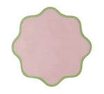 The Daisy Table Linen Collection by Duggan Society features a pink, scalloped-edged design with a green border, reminiscent of elegant table linens, set against a white background.