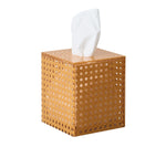 The Kim Seybert Natural Reed Bath Collection features a square, woven rattan tissue box holder with a wicker cane design and a white tissue emerging from the top, displayed against a plain white background.