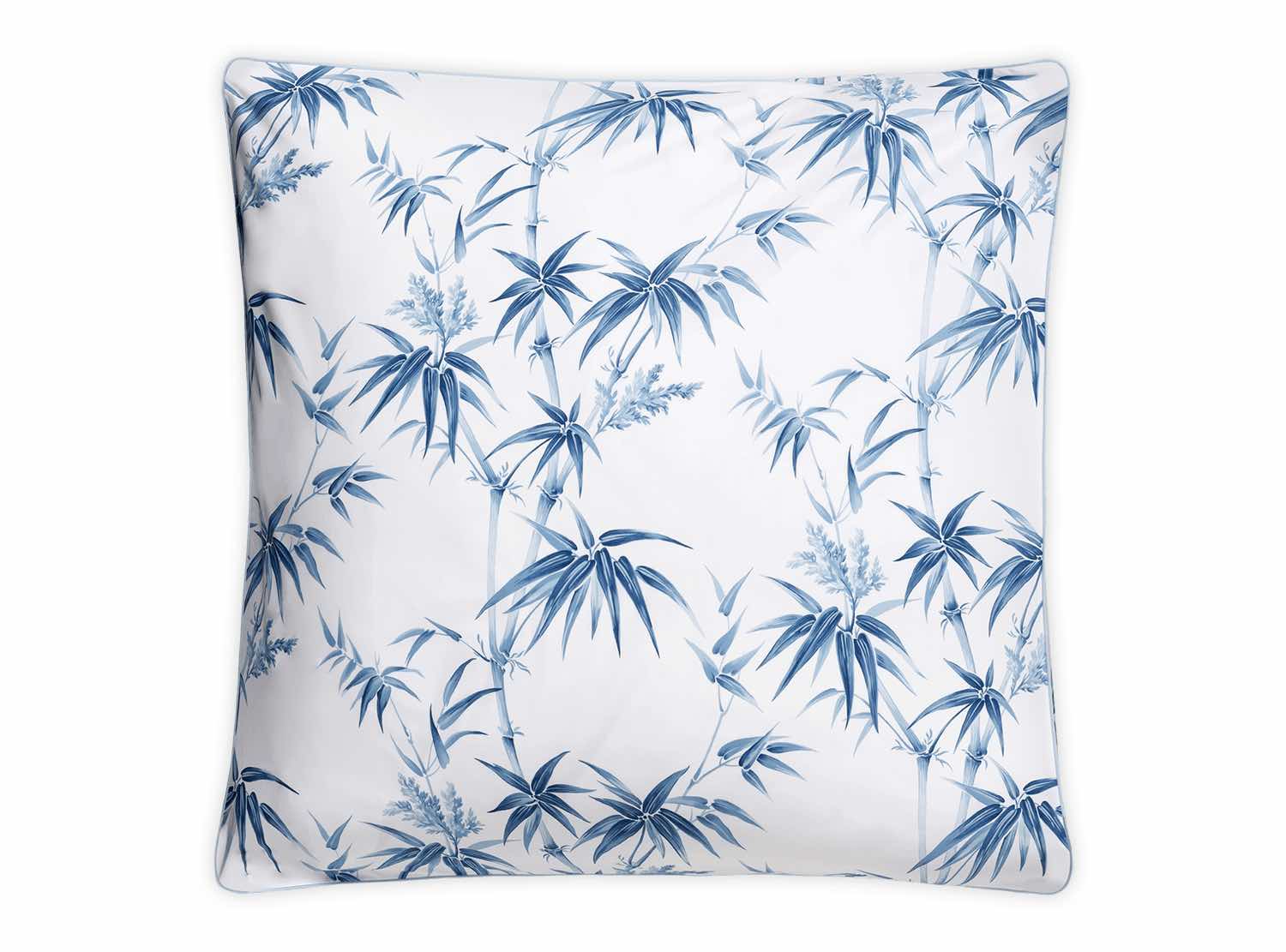 The Dominique Bedding Collection, Azure by Matouk features a square pillow with a white background and bold blue bamboo leaf and stem pattern, crafted from soft Egyptian cotton and OEKO-TEX® certified for comfort and safety.