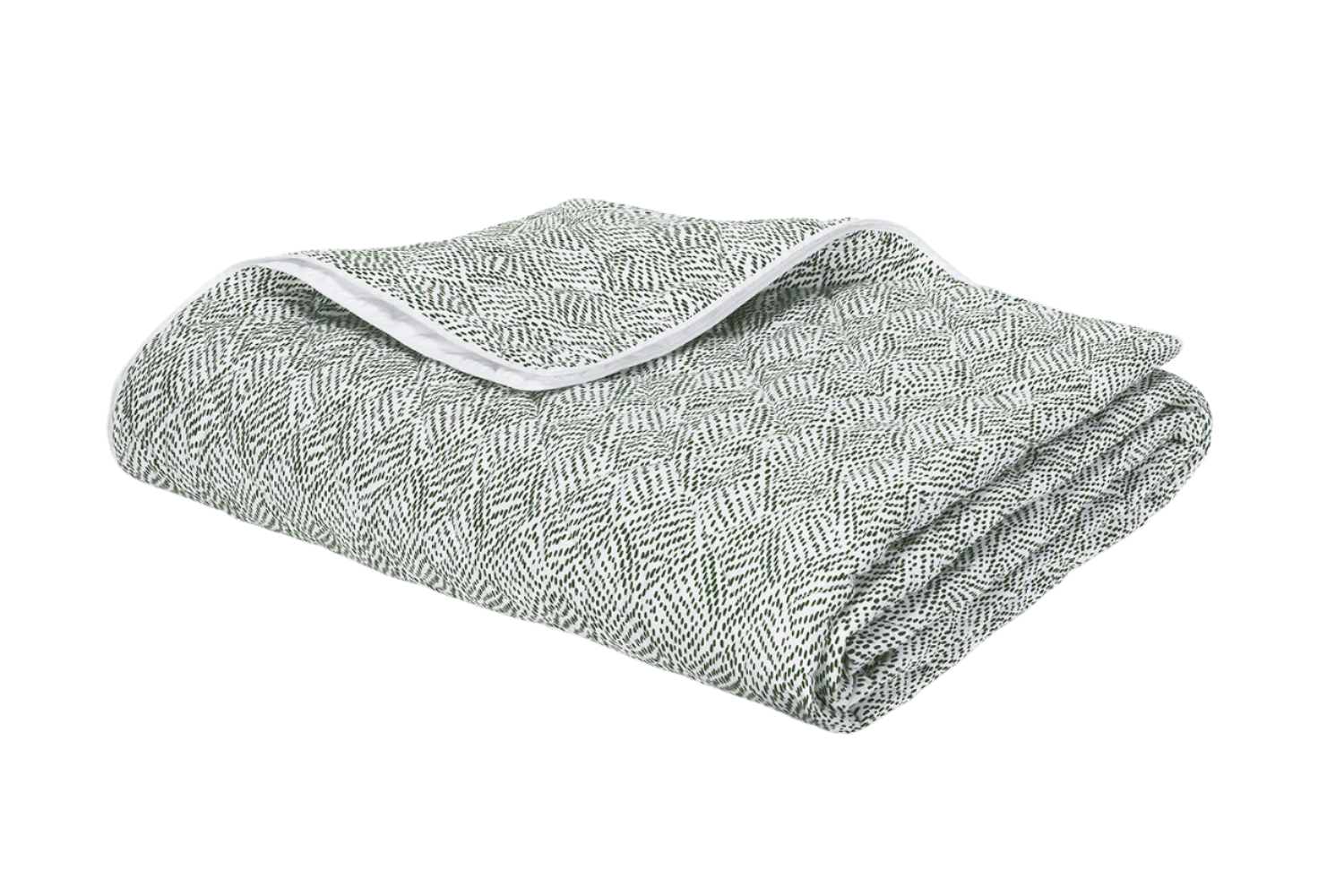 A folded green and white Matouk Duma Diamond Bedding Collection blanket in Grass, OEKO-TEX® certified, featuring a textured geometric pattern and soft white trim.