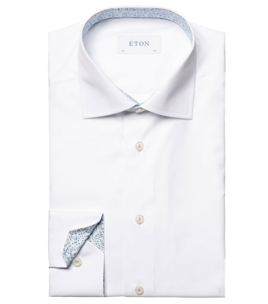 A new Eton White Solid Floral Contrast Poplin shirt with a floral micro print on the inside collar and cuffs, laid out flat and buttoned up.