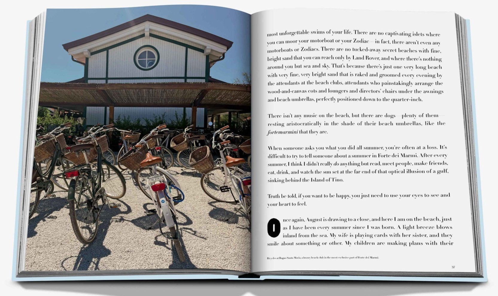An open book titled "Forte dei Marmi" by Assouline, showcasing an image of bicycles parked in front of a building in Forte dei Marmi. The book is open to a page adorned with text and a photo on the left side, evoking memories of an Italian vacation along Tuscany's Mediterranean coast.