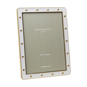 The Addison Enamel Locket Picture Frame, in white enamel with a gold border and decorative rivets, elegantly features "ADDISON ROSS LONDON" and fits size "5"x7" (13x18cm).