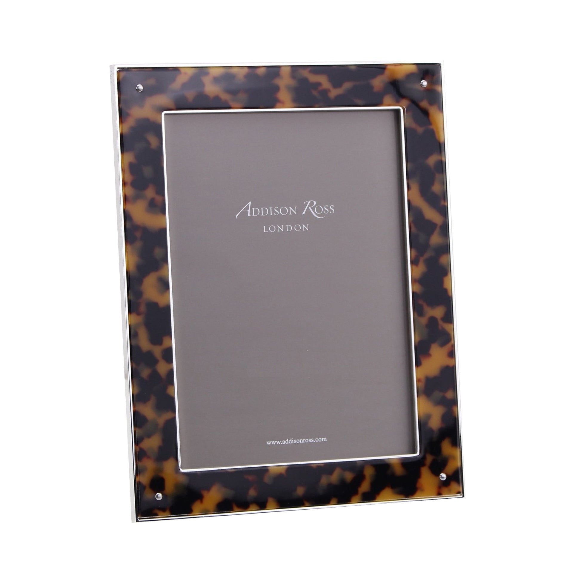 The Addison Ross Tortoiseshell and Silver Photo Frame (5 x 7) features a faux tortoise shell-patterned border, silver plate trim, and a luxury velvet back for an elegant finish. The rectangular frame stands upright against a white background.
