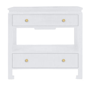 The Wylder Nightstand Collection by Made Goods features a sleek nightstand with three drawers, gold knobs, high gloss linen finish, and an open shelf between the drawers.