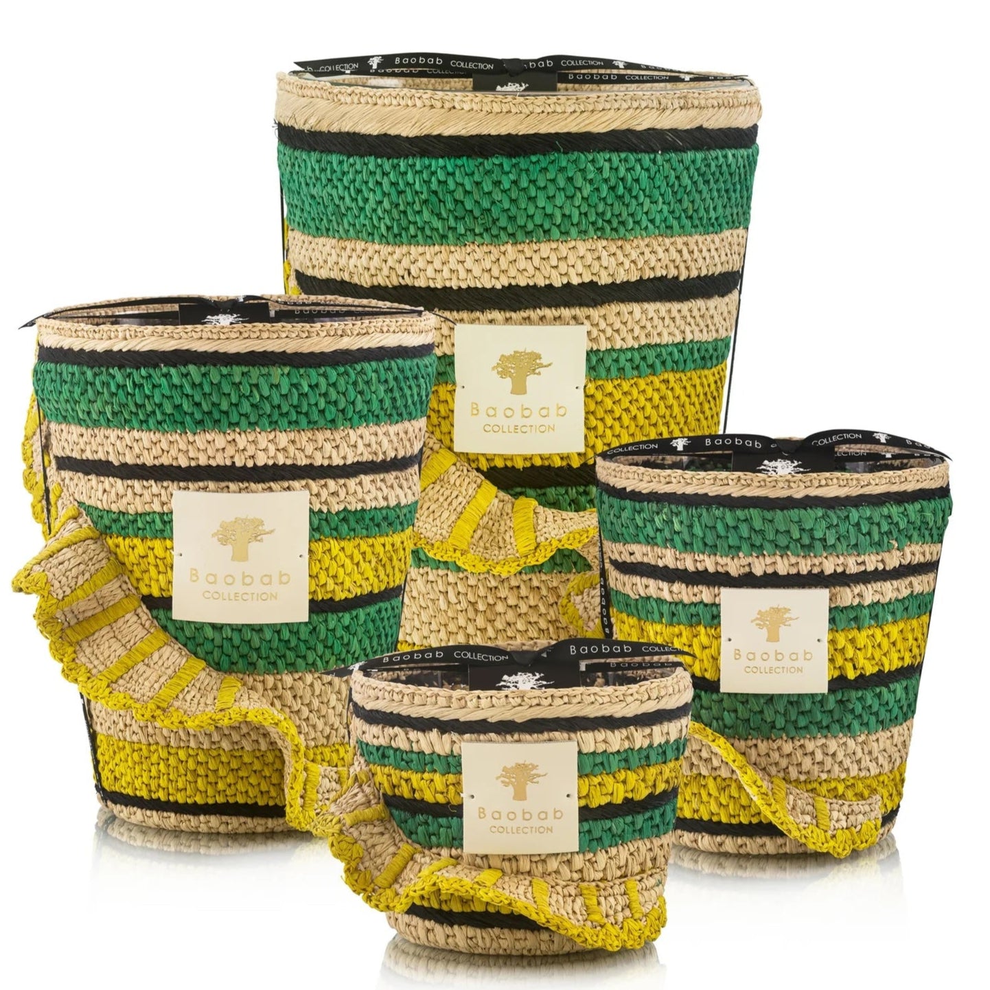 Four Baobab Collection "Fety Milalao" woven baskets in different sizes with green, black, and yellow stripes and a hint of vetiver.