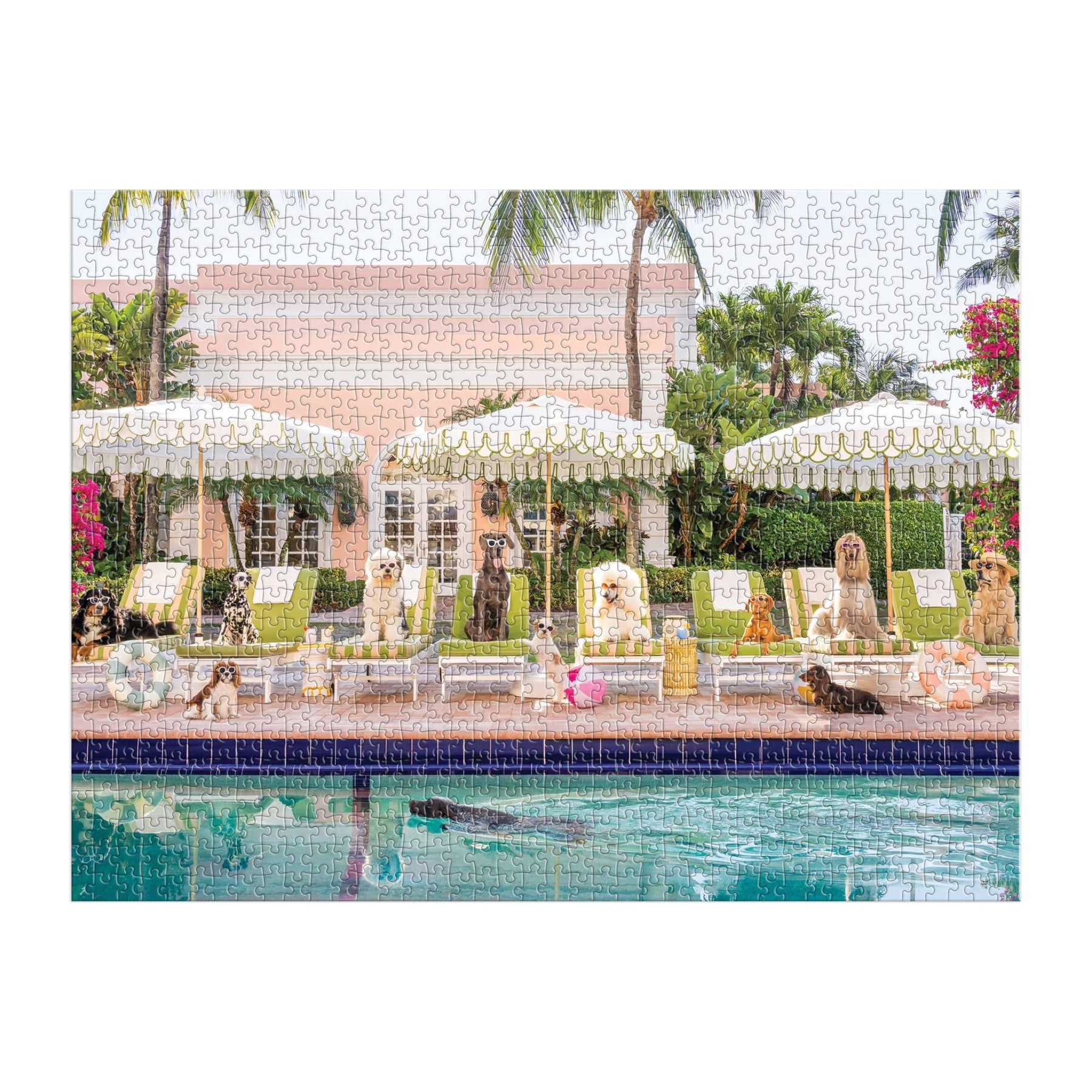 A group of dogs lounges by poolside chairs under striped umbrellas, reminiscent of a Gray Malin photograph. The shimmering pool and The Colony Hotel with swaying palms create a quintessential Palm Beach scene featured in the Gray Malin 1000 Piece Puzzle by Chronicle Books.