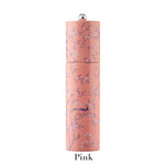 The Addison Ross Chinoiserie Salt and Pepper Mill Collection features a pink cylindrical rubber wood mill, adorned with delicate floral and bird motifs in Chinoiserie style, labeled "Pink" at the base.