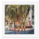 A group of people in vibrant attire pose on a circular platform surrounded by water and palm trees, echoing Slim Aarons' iconic photography in Getty Images' "Young Society," from April 1, 1964, offered by Soicher Marin.