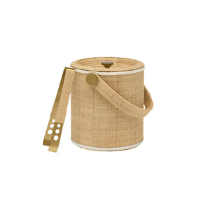 An elegant cylindrical ice bucket from Blue Pheasant's Gable Natural/White Barware Collection features raffia detail, leather trim, a lid, side handle, and gold metal ice tongs resting on the rim.