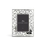 The Michael Aram Heart Frame features a hand-forged look with interlocking heart shapes as a symbol of love, and displays a 4x6 inch "Michael Aram" placeholder card.