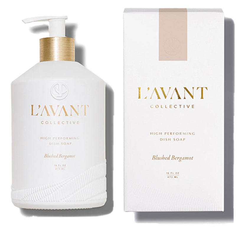 A white bottle of L’Avant Collective Blushed Bergamot Dish Soap is displayed beside its matching box packaging.