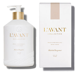 A white bottle of L’Avant Collective Blushed Bergamot Dish Soap is displayed beside its matching box packaging.